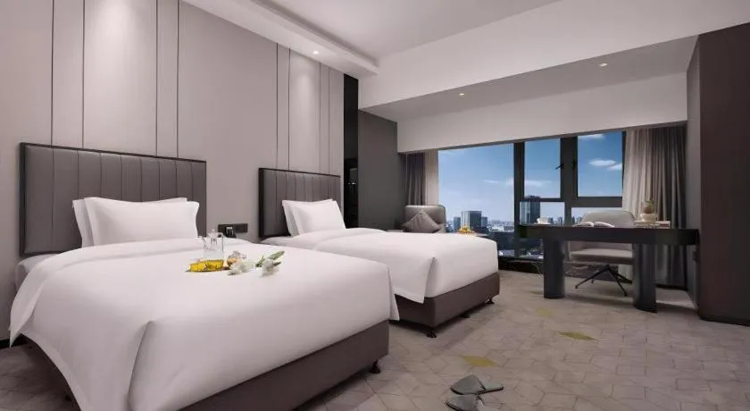 Bed in Changsha Jasmine International Hotel