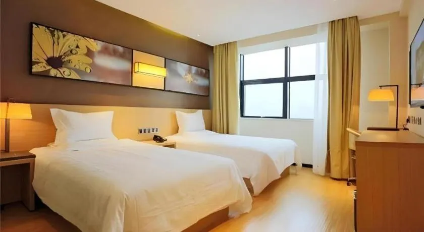 Bed in IU Hotel Tianjin Tianta Scenic Spot Wujiayao Metro Station