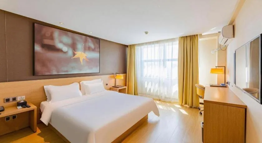 Bed in IU Hotel Tianjin Tianta Scenic Spot Wujiayao Metro Station