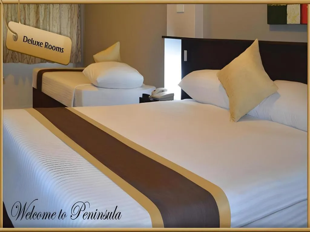 Bed in Peninsula International Hotel
