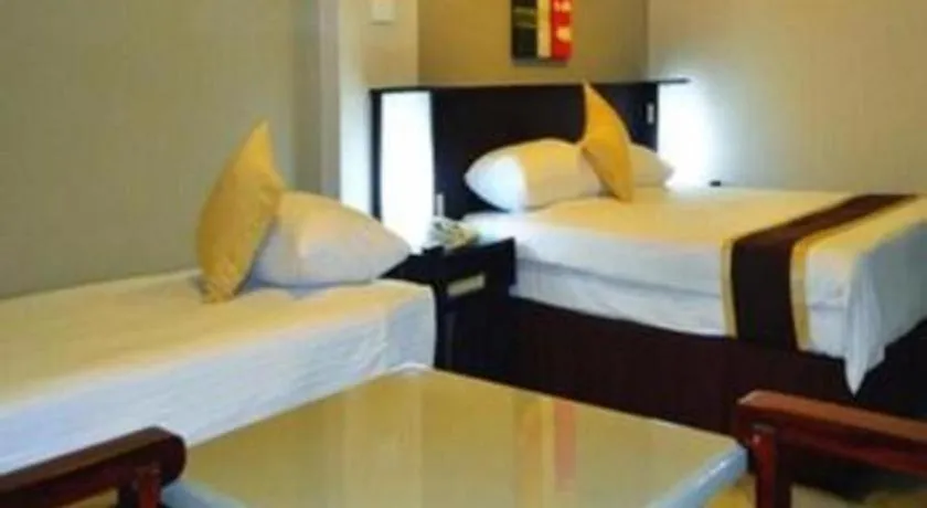Bed in Peninsula International Hotel