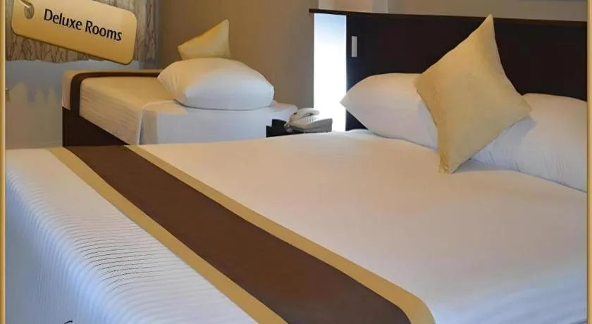 Bed in Peninsula International Hotel