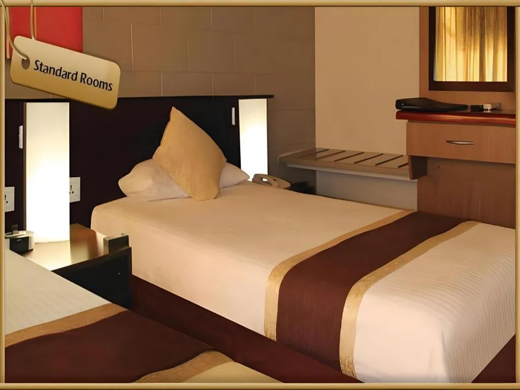 Bed in Peninsula International Hotel