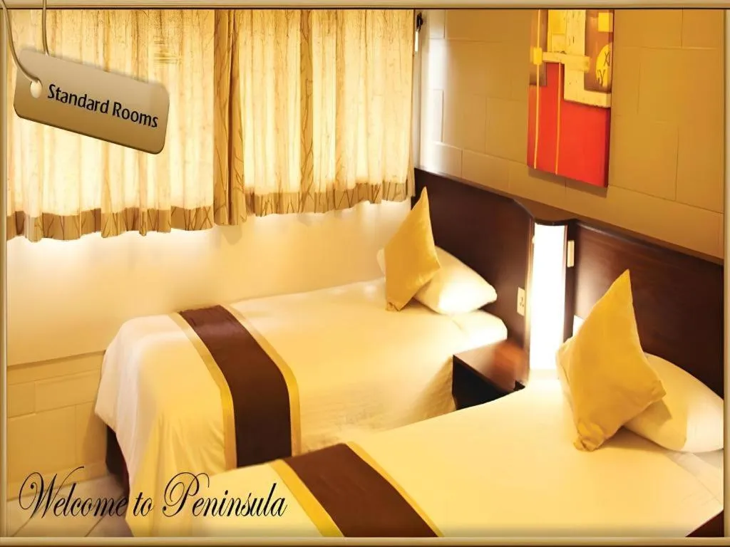 Bed in Peninsula International Hotel