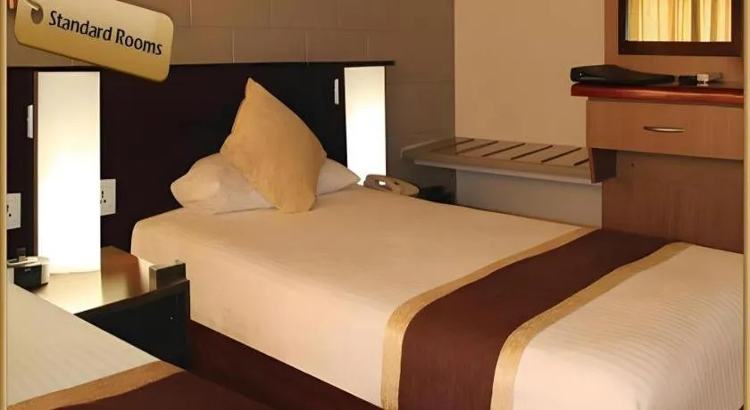 Bed in Peninsula International Hotel