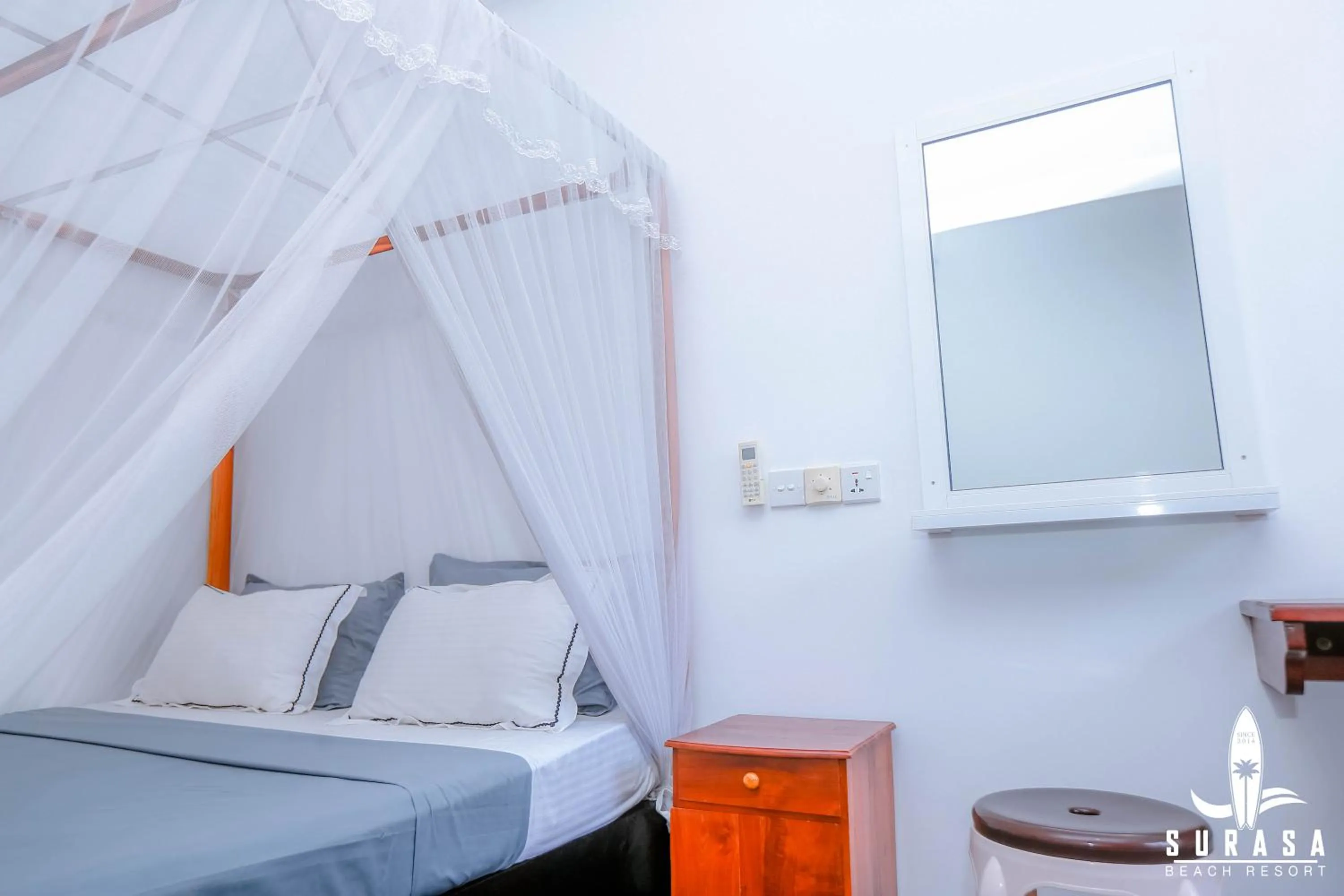 Bed in Surasa Beach Resort