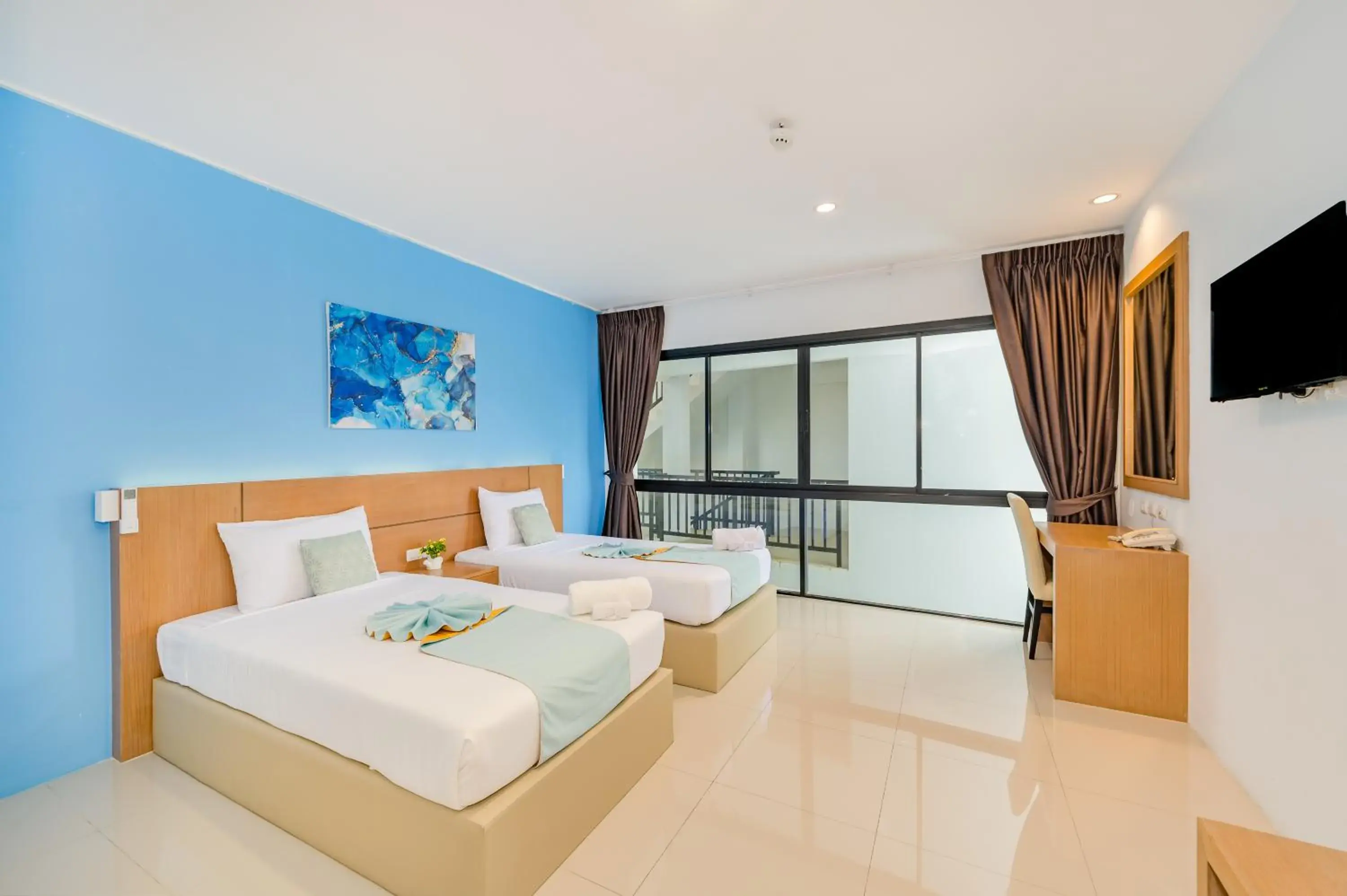 Bed in De Blue Sea Rawai Hotel Bed in De Blue Sea Rawai Hotel