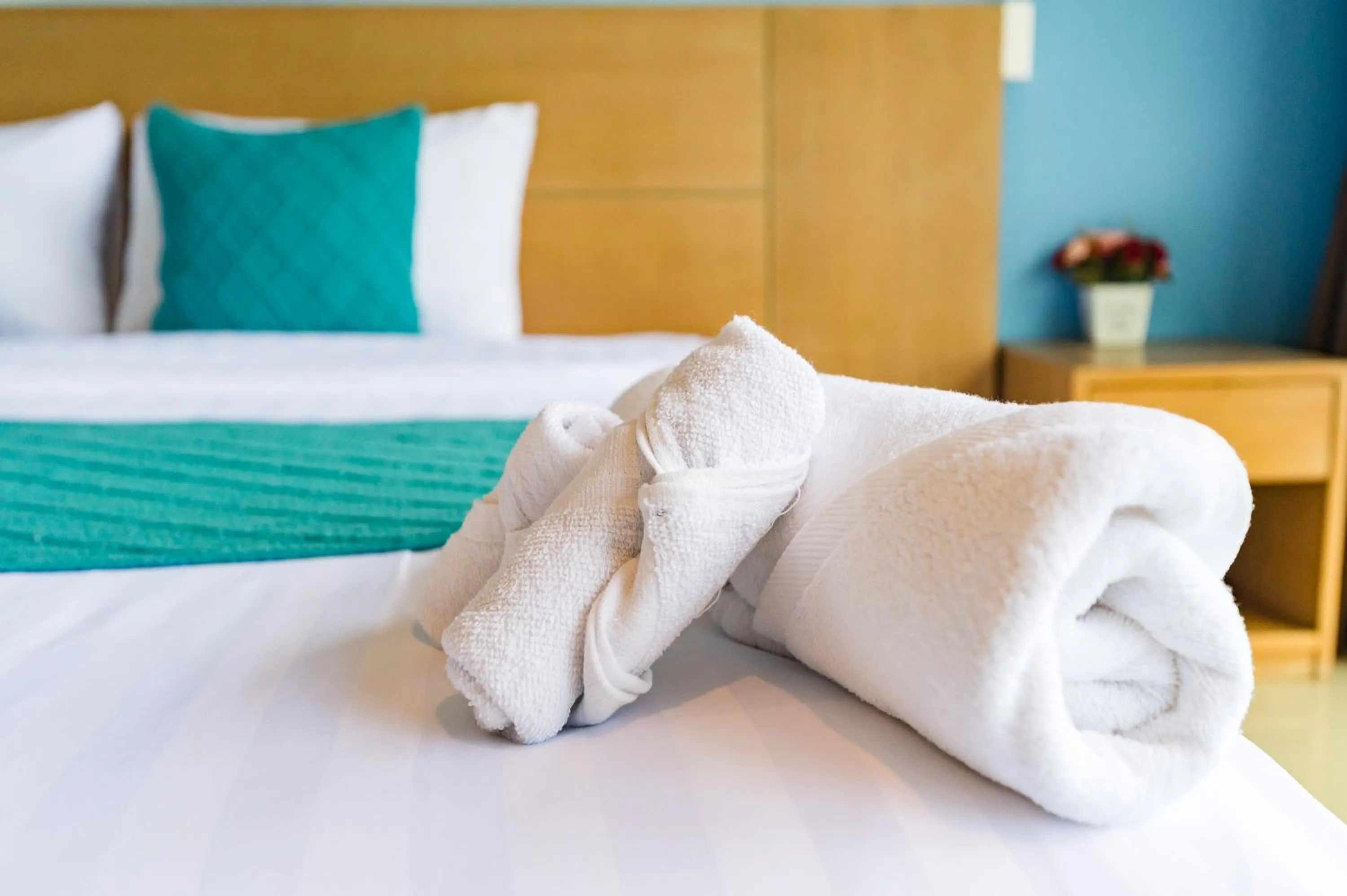 Bed in De Blue Sea Rawai Hotel