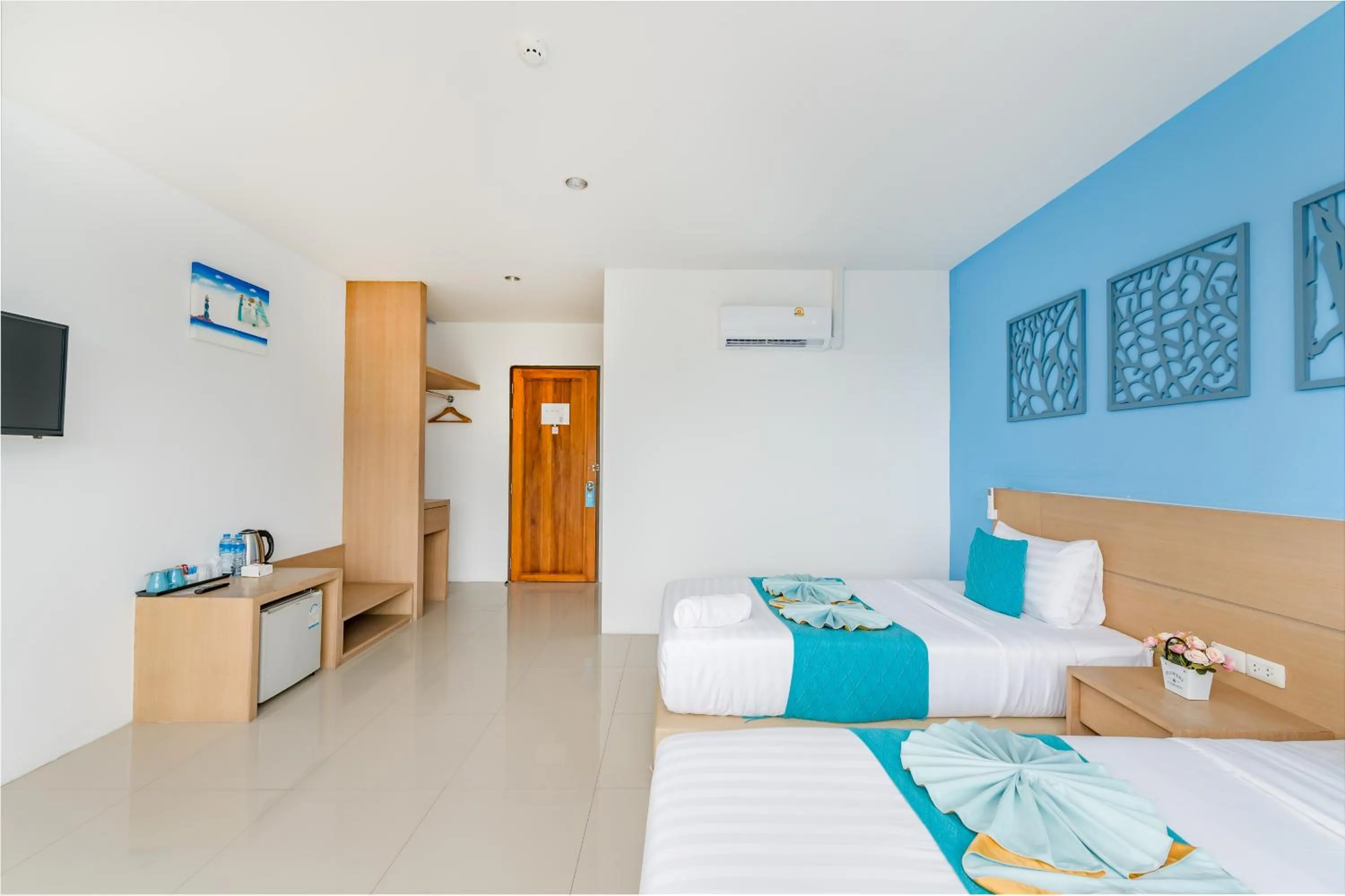 Bed in De Blue Sea Rawai Hotel