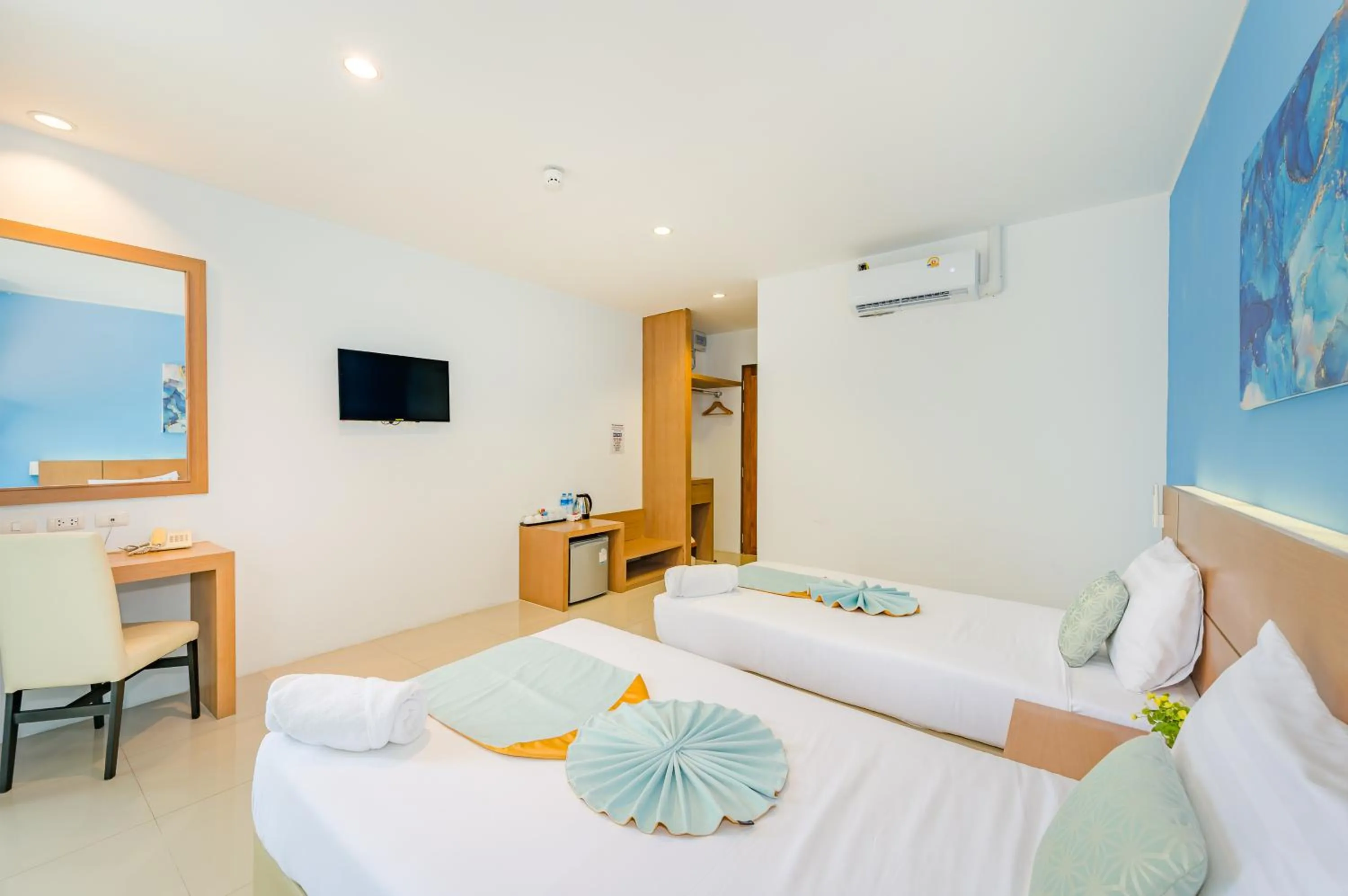 Bed in De Blue Sea Rawai Hotel