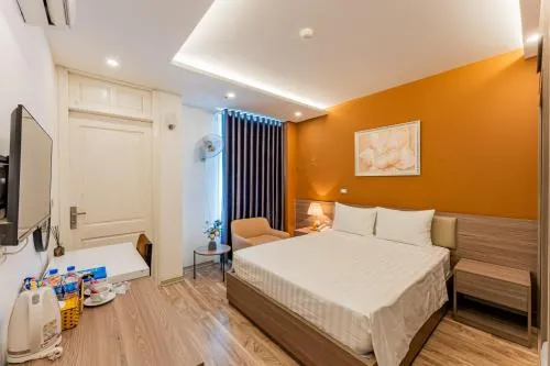 Communal lounge/ TV room, Bed in Moon Hotel 26 Do Quang