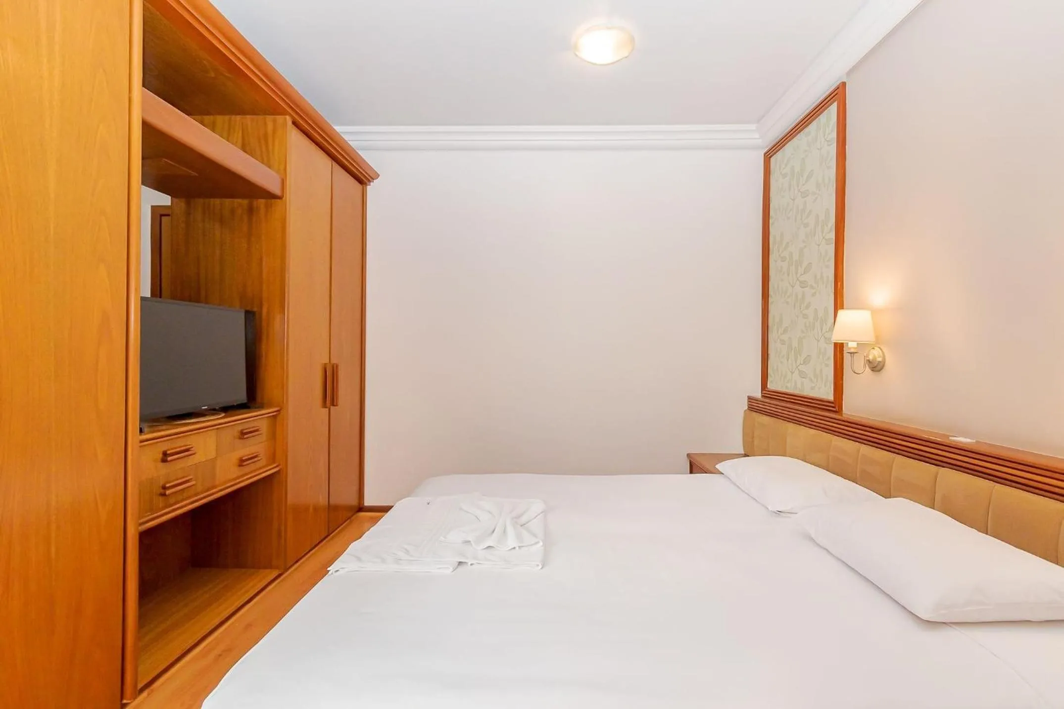 Bedroom, Bed in Batel Residence | Avenida do Batel | Gonzaga Stays