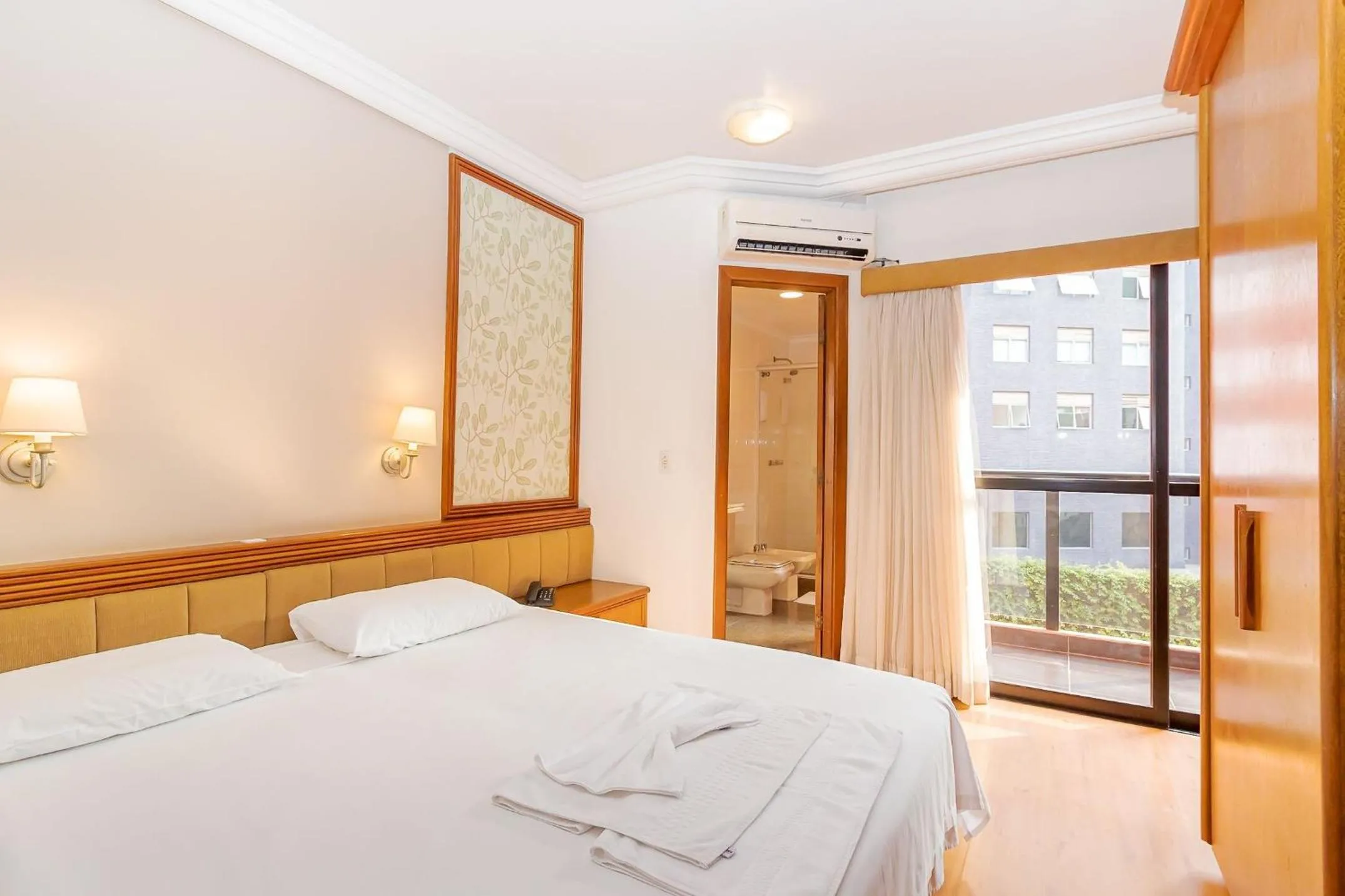 Bedroom, Bed in Batel Residence | Avenida do Batel | Gonzaga Stays