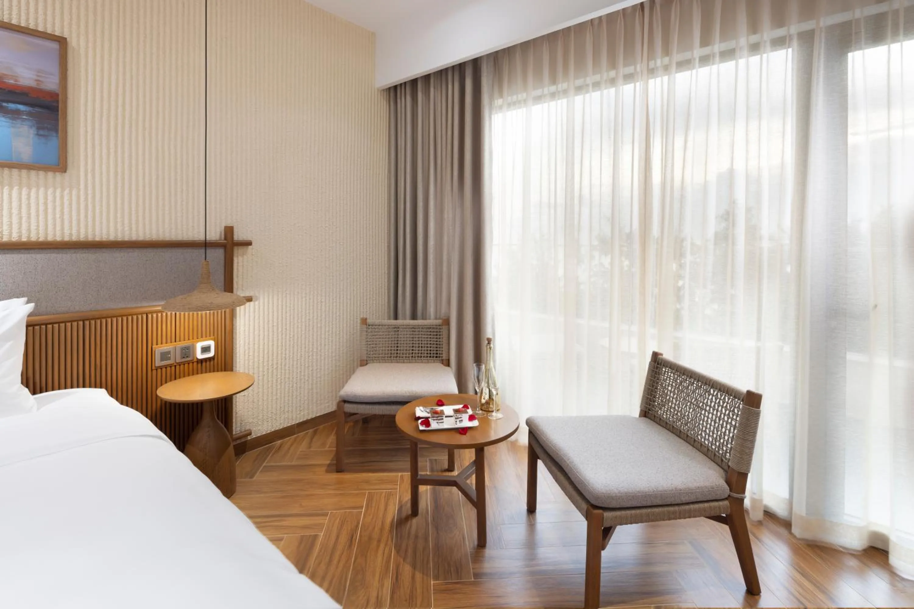 Seating area, Bed in Iconic Long Hai Hotel