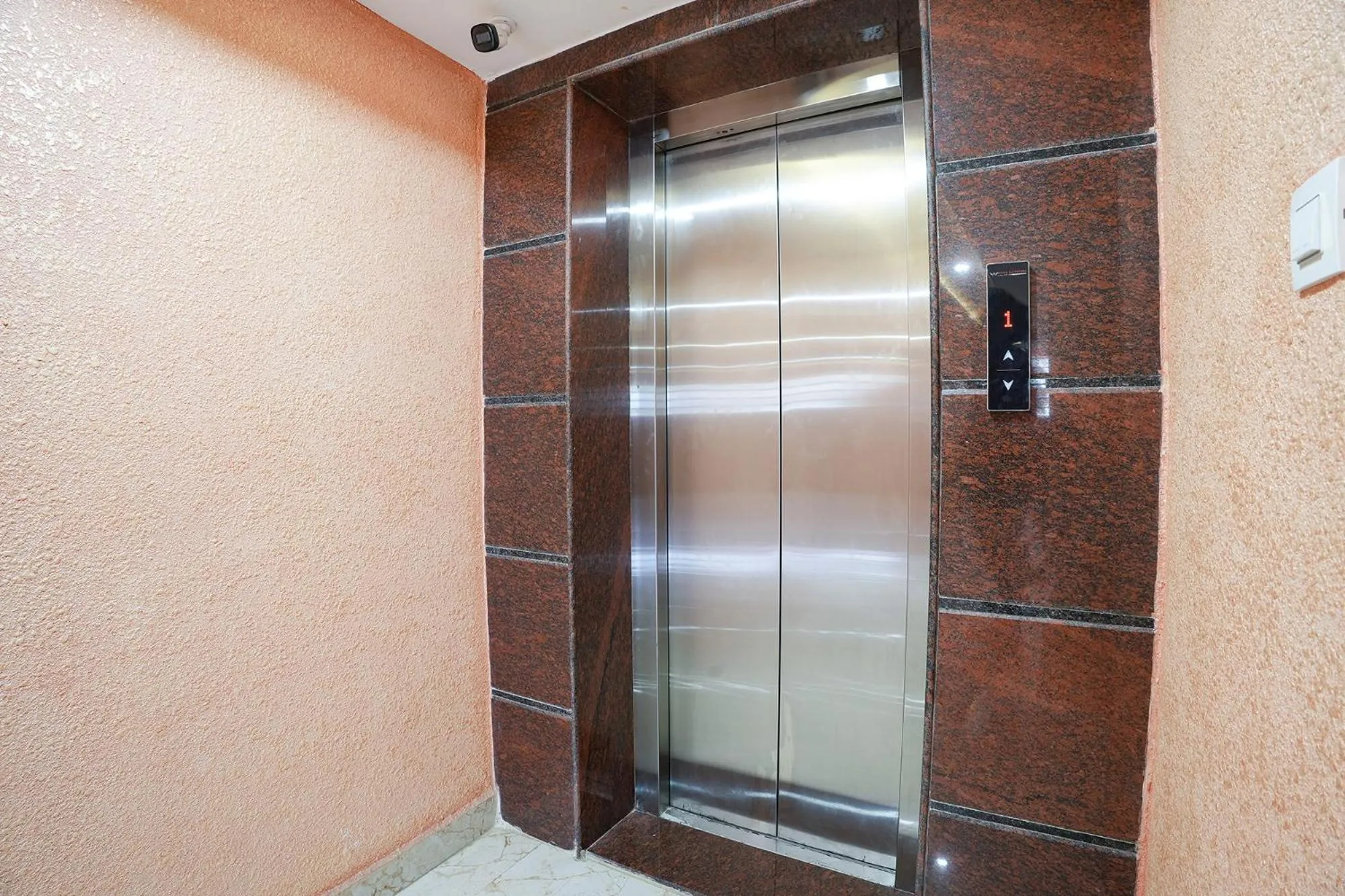 elevator in FabHotel A White Pearl Suites - Yelahanka
