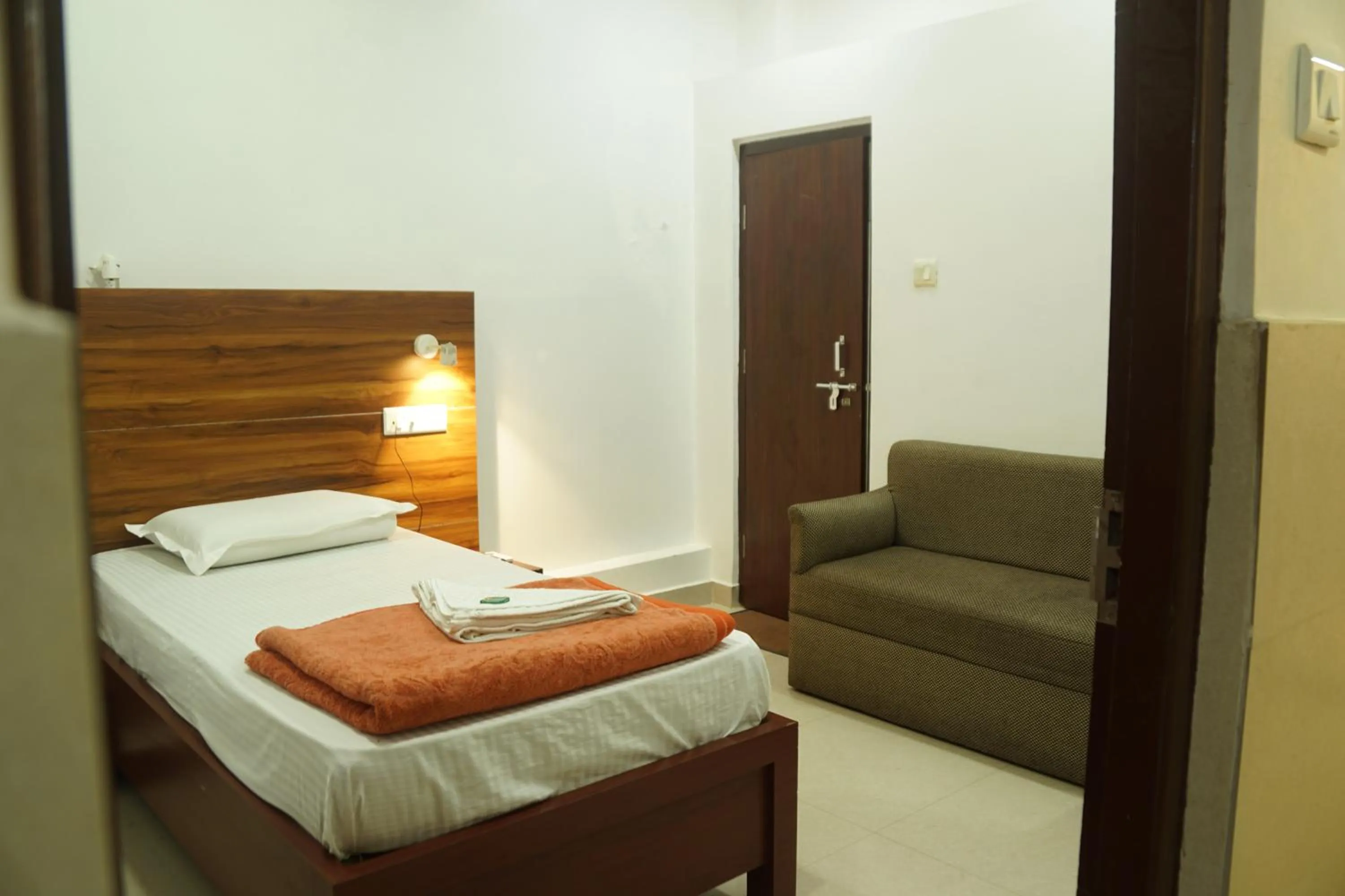 Bed in Subhash Hotel