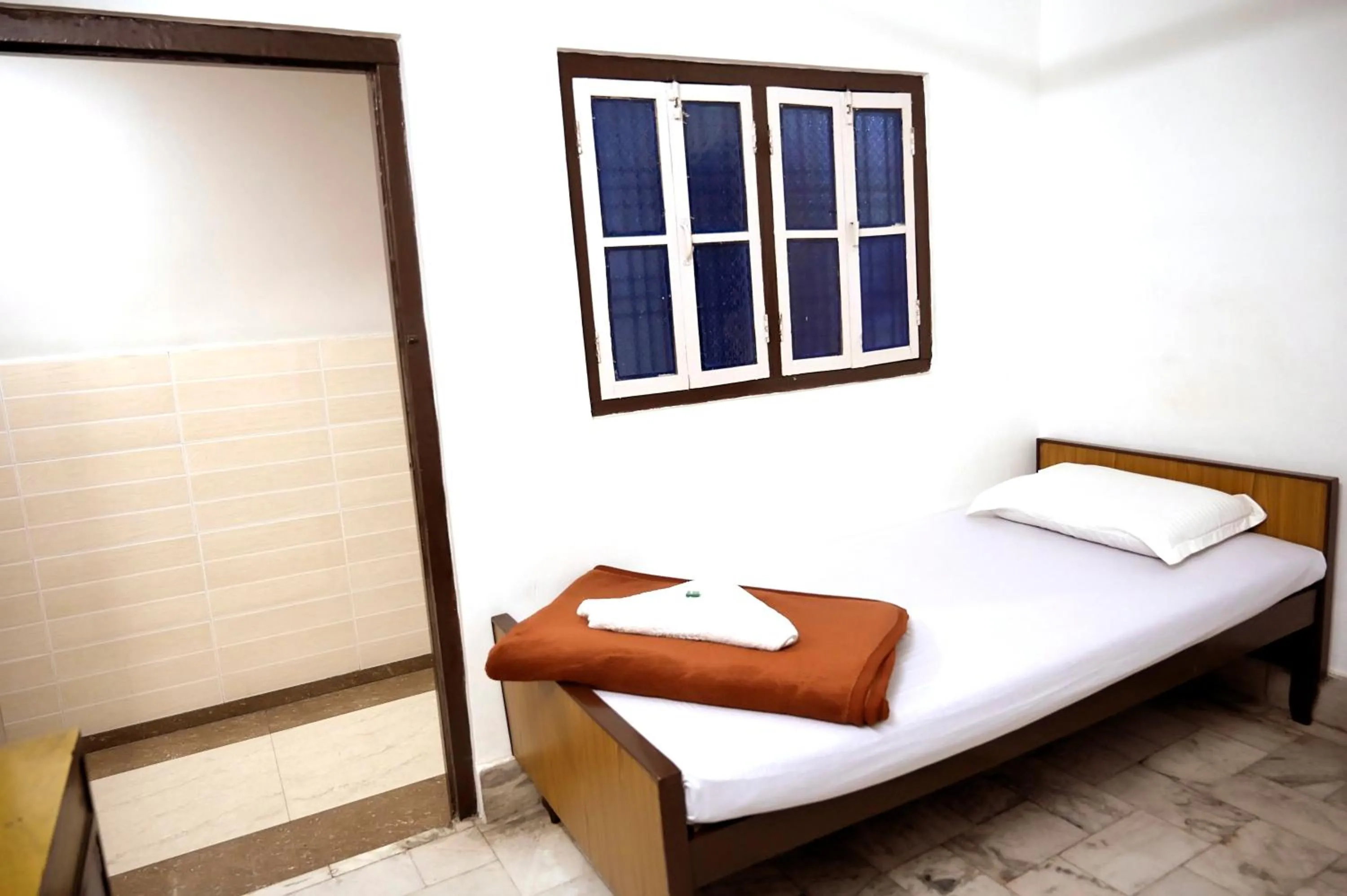 Bed in Subhash Hotel