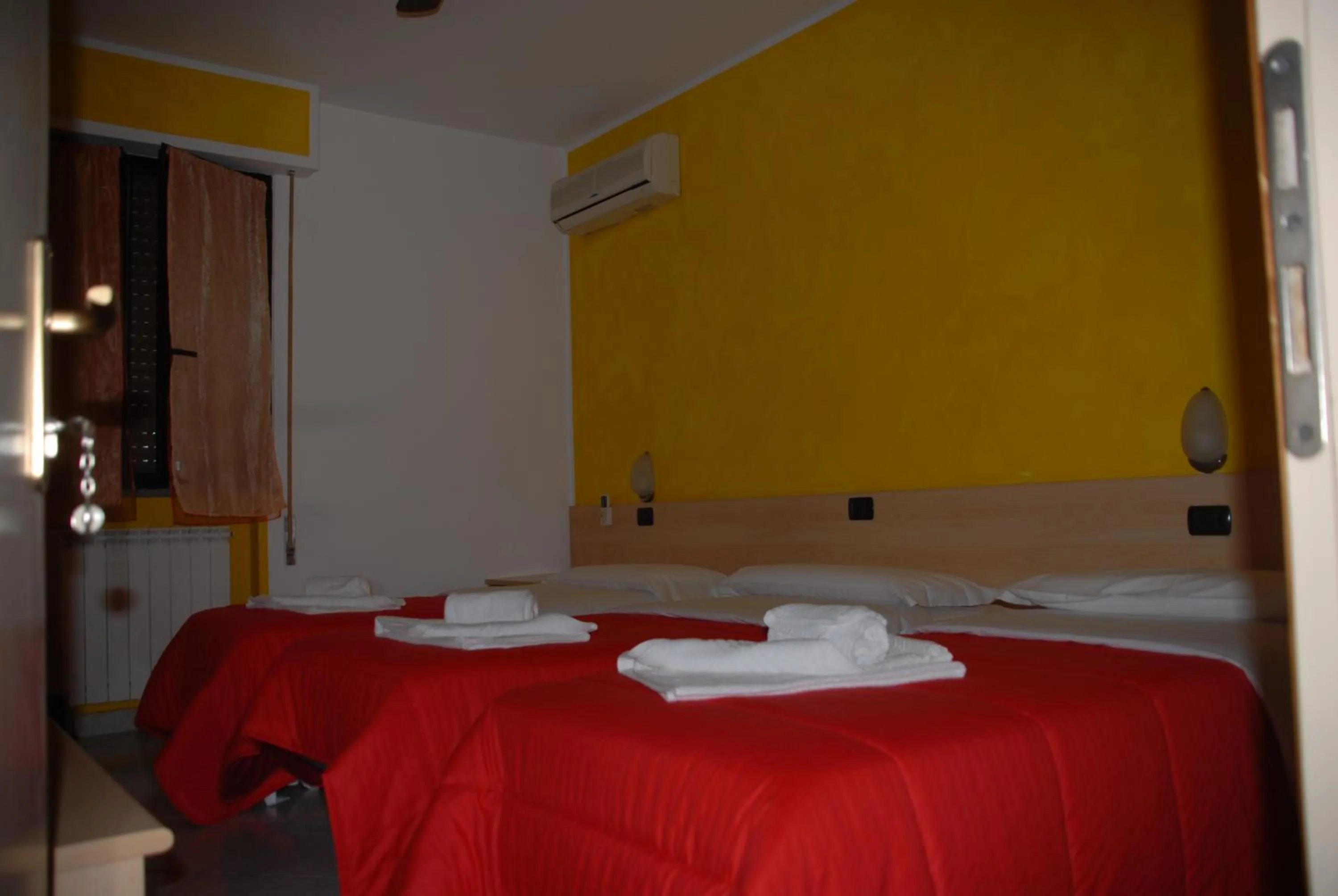 Bed in Hotel Ristorante Il Calipso by Mago