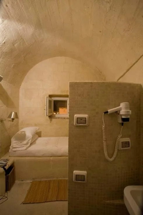 Bedroom in L'Hotel In Pietra