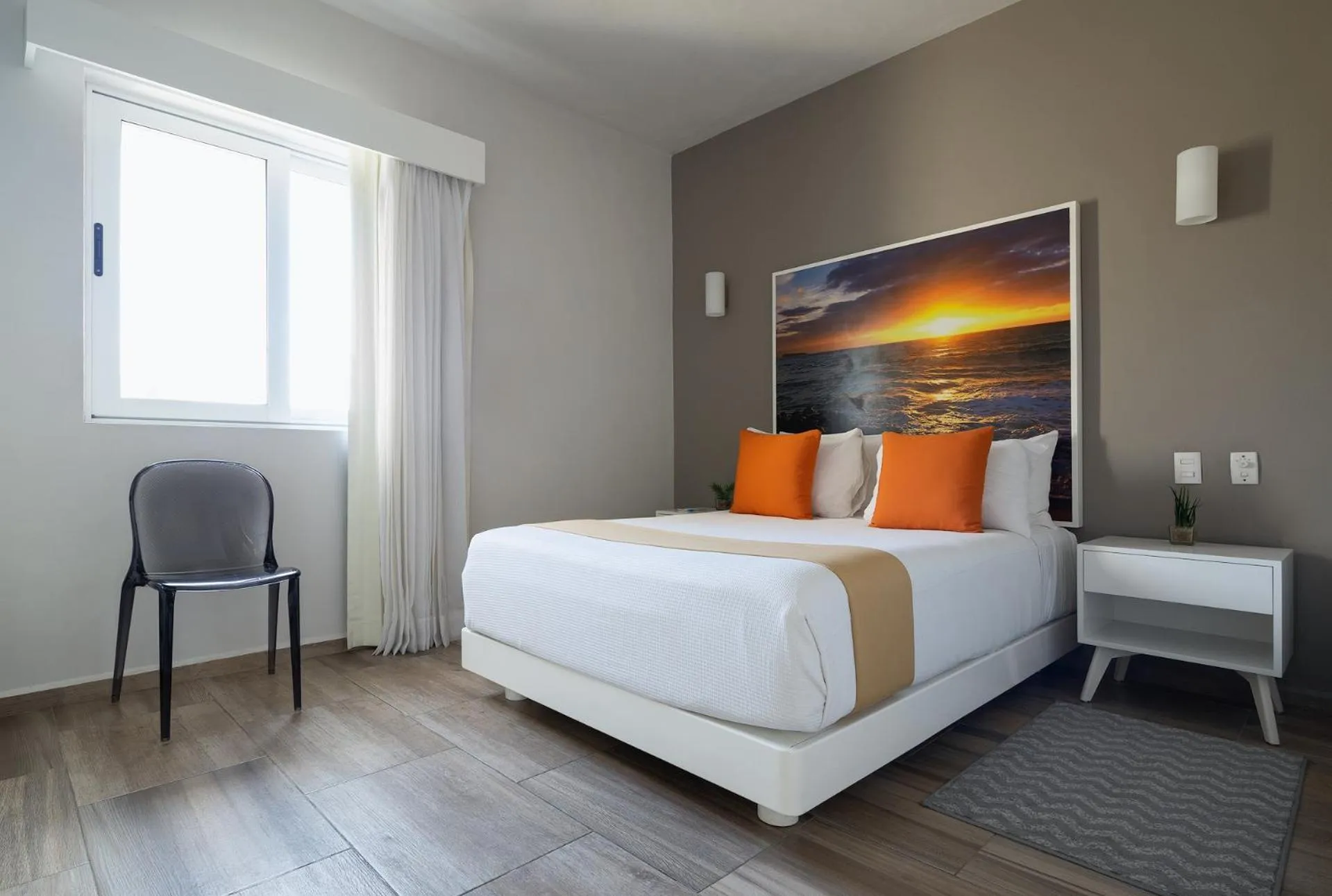 Seating area, Bed in Azura Boutique Hotel