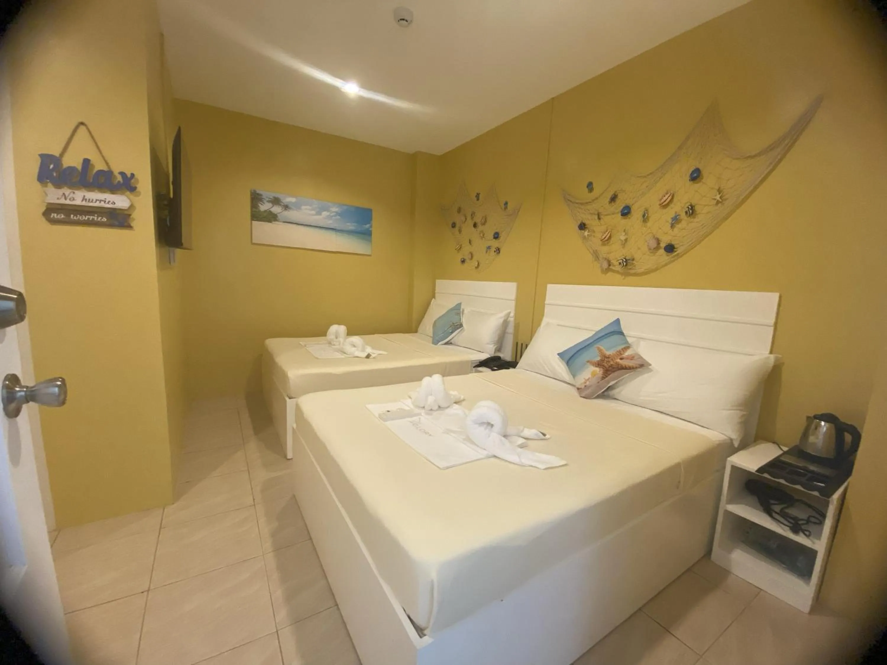 Bed in Glory Inn and Suites Boracay