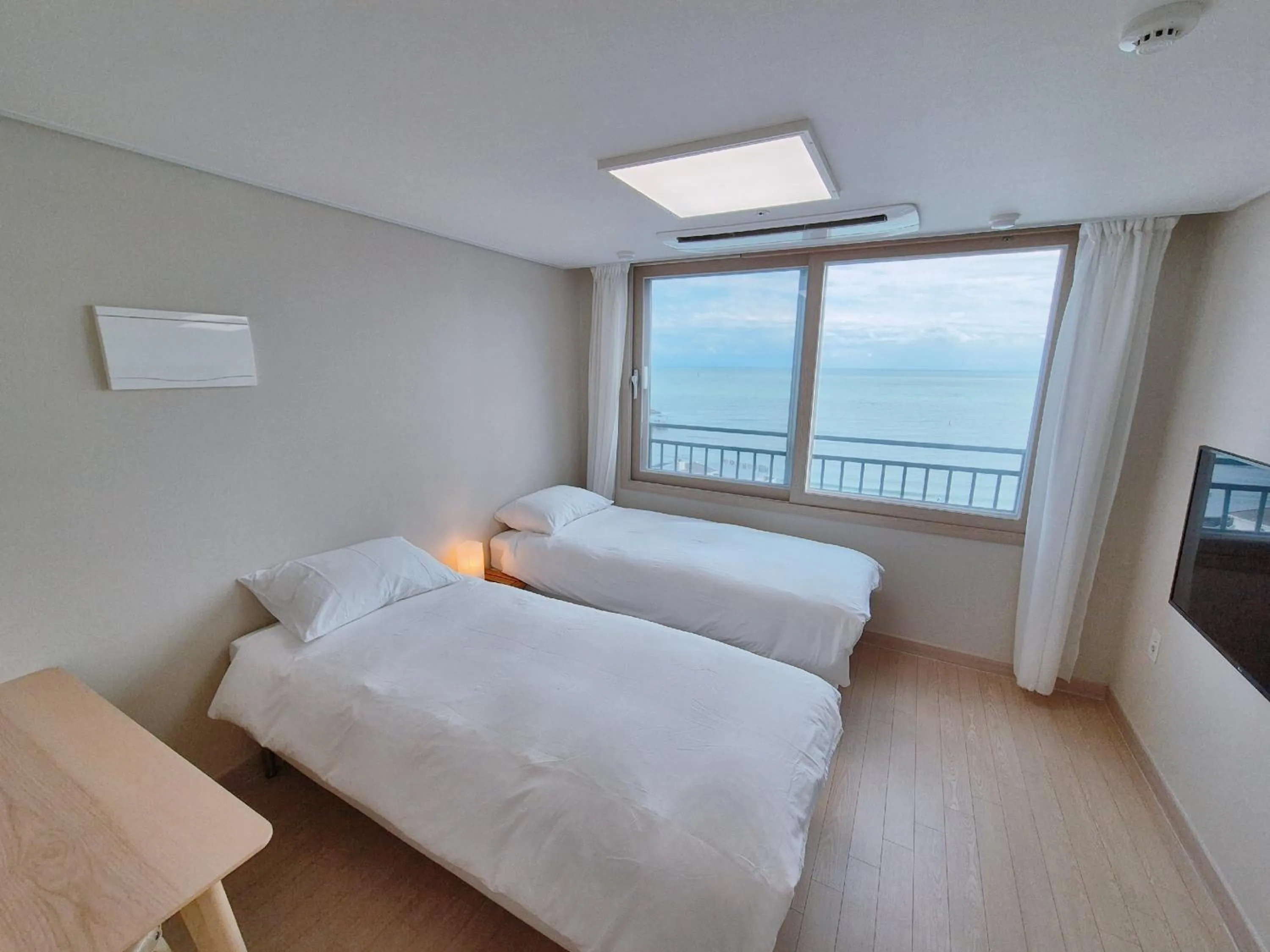 Sea view, Bed in The First Ocean Songjeong