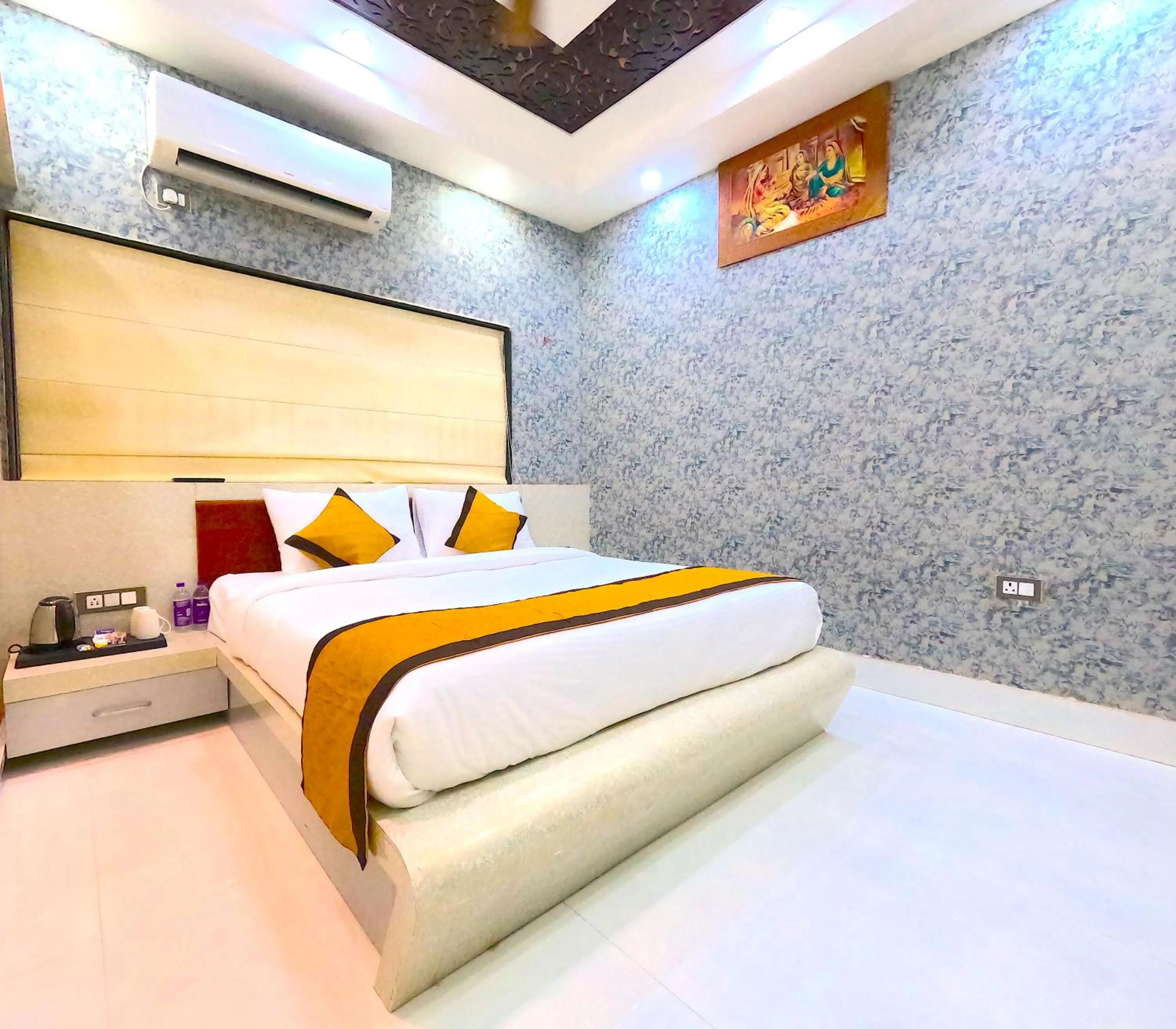 Bed in THE MANTRA- A Luxury Boutique Hotel