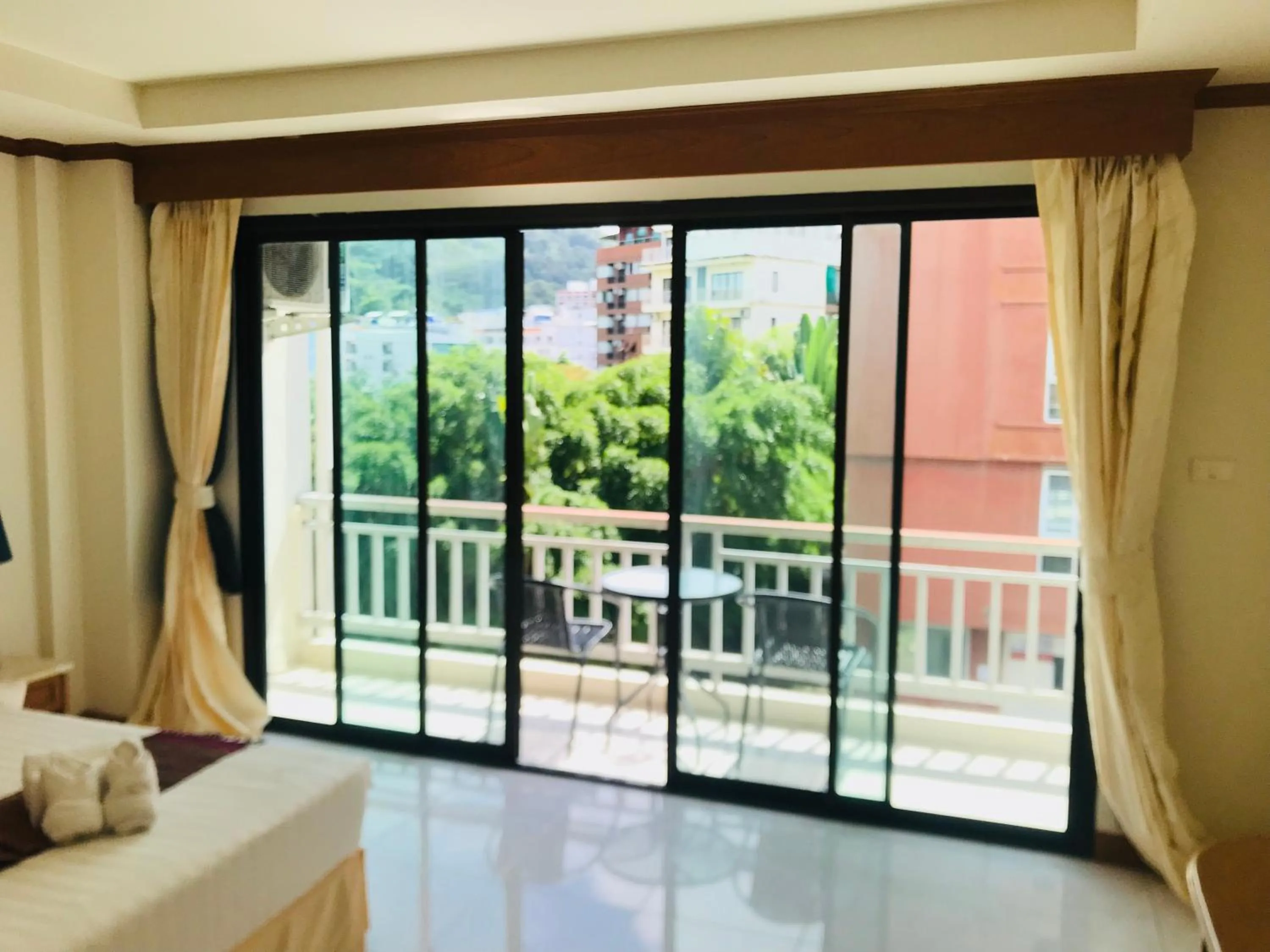 Bed in Global Hotel Beach View