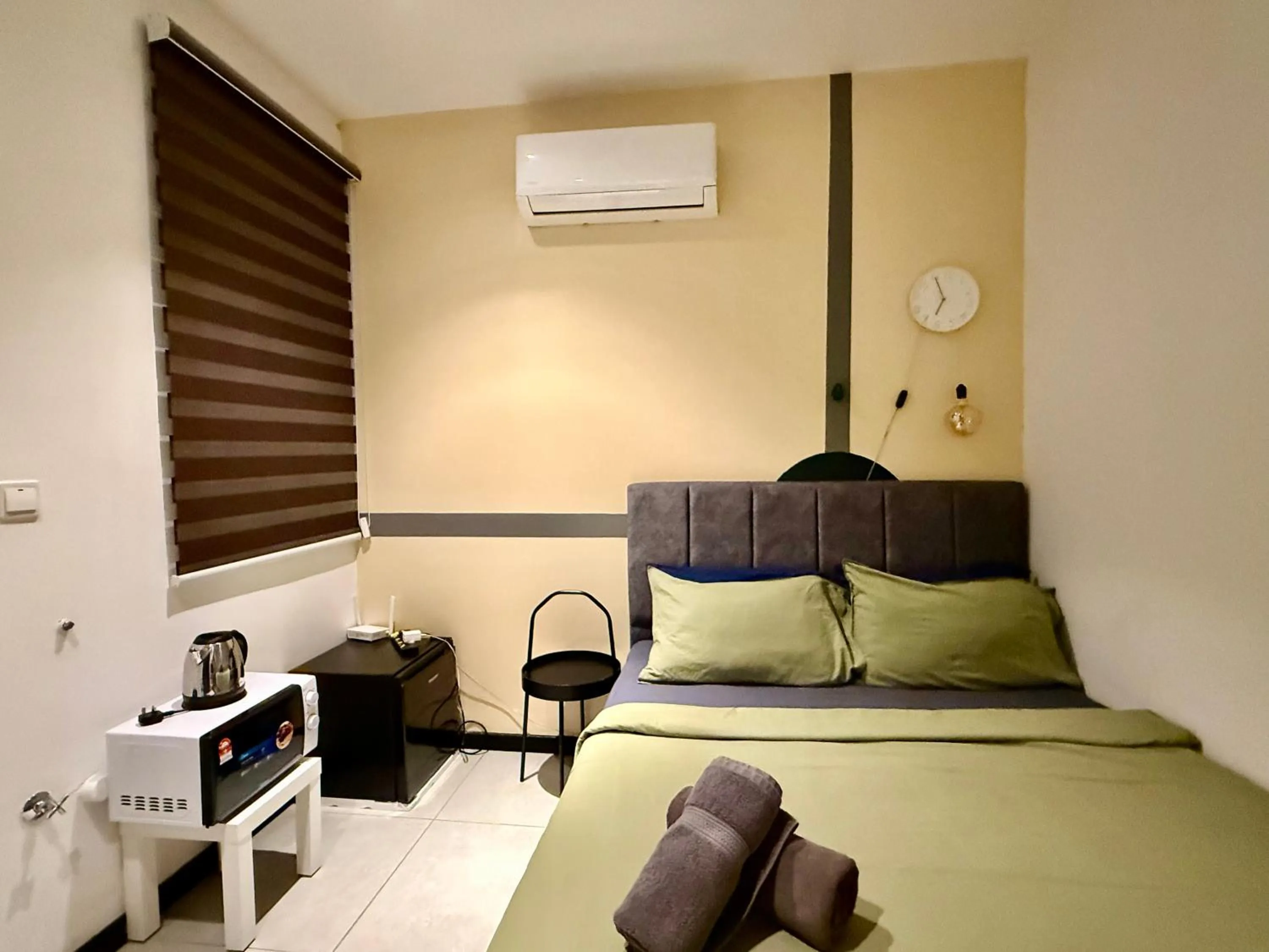 Bed in Neu Suites Service Apartment By Moonlight