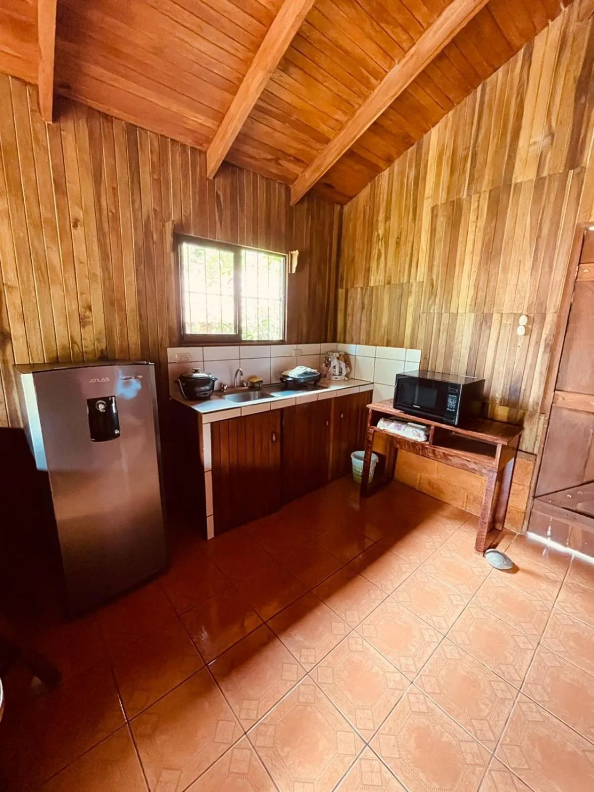 Kitchen or kitchenette in Cabinas La Catarata