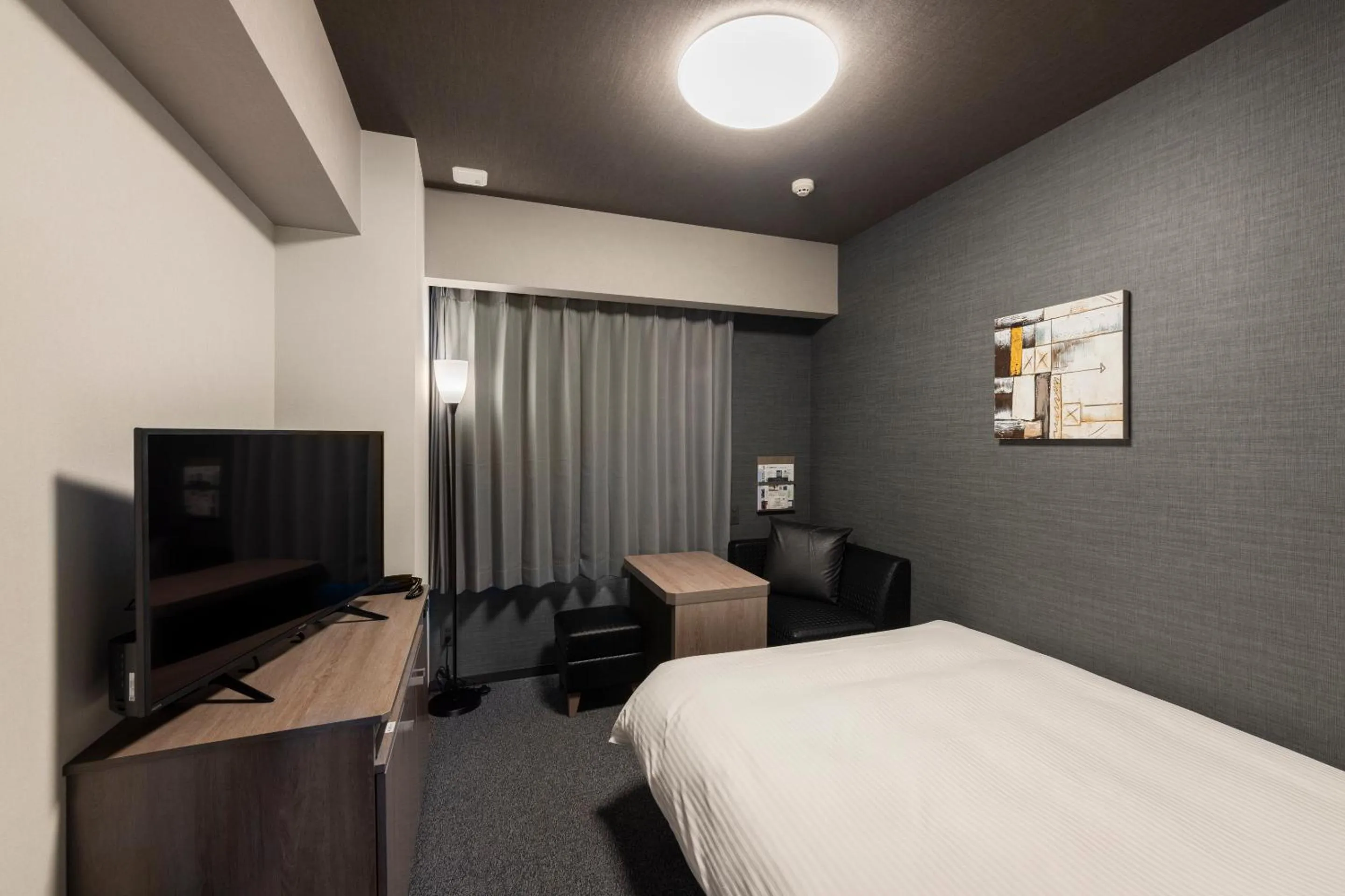 Photo of the whole room, Bed in Hotel Route Inn Grand Nagoya Fujigaoka Ekimae