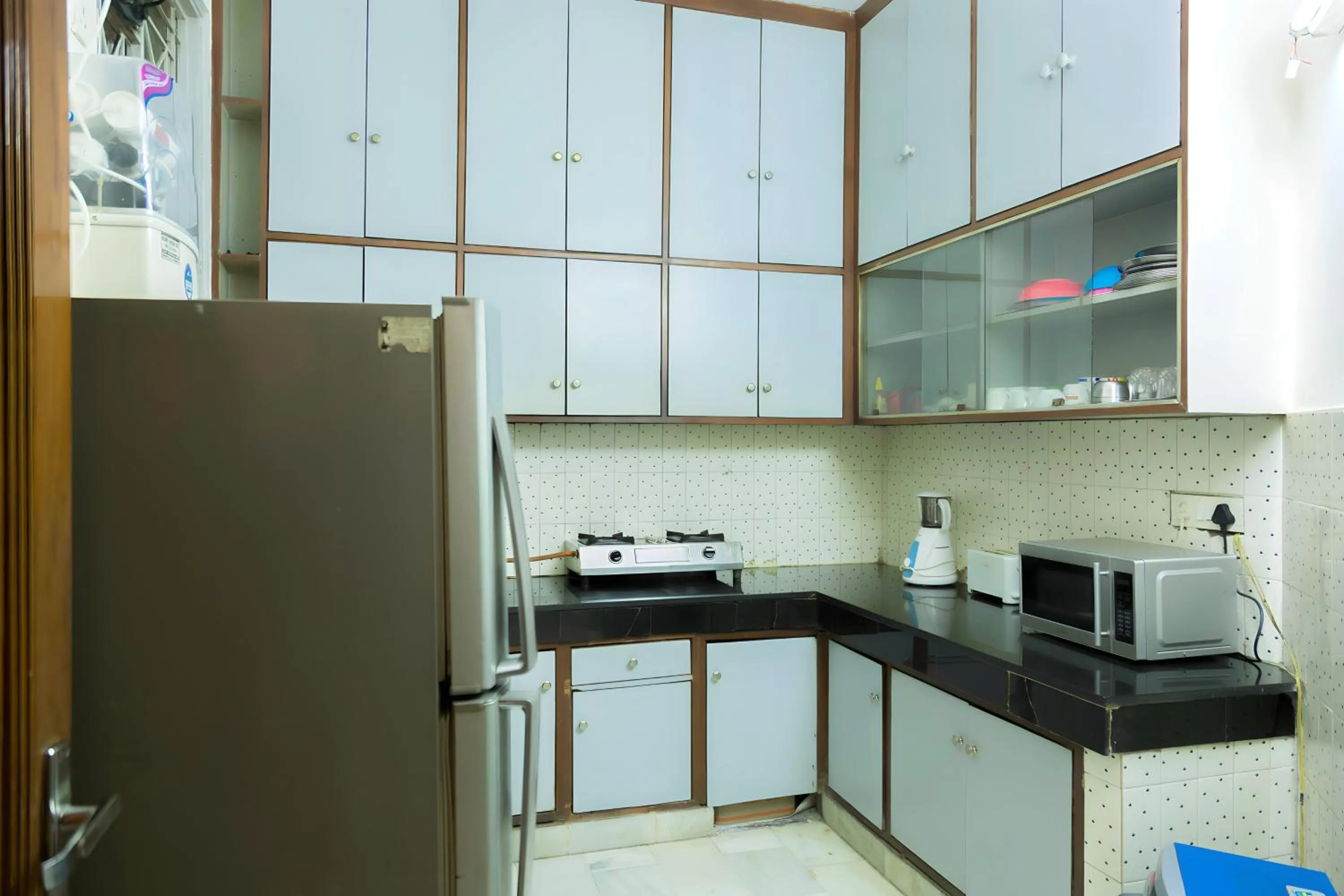 Kitchen or kitchenette in Woodpecker Apartments Hauz khas
