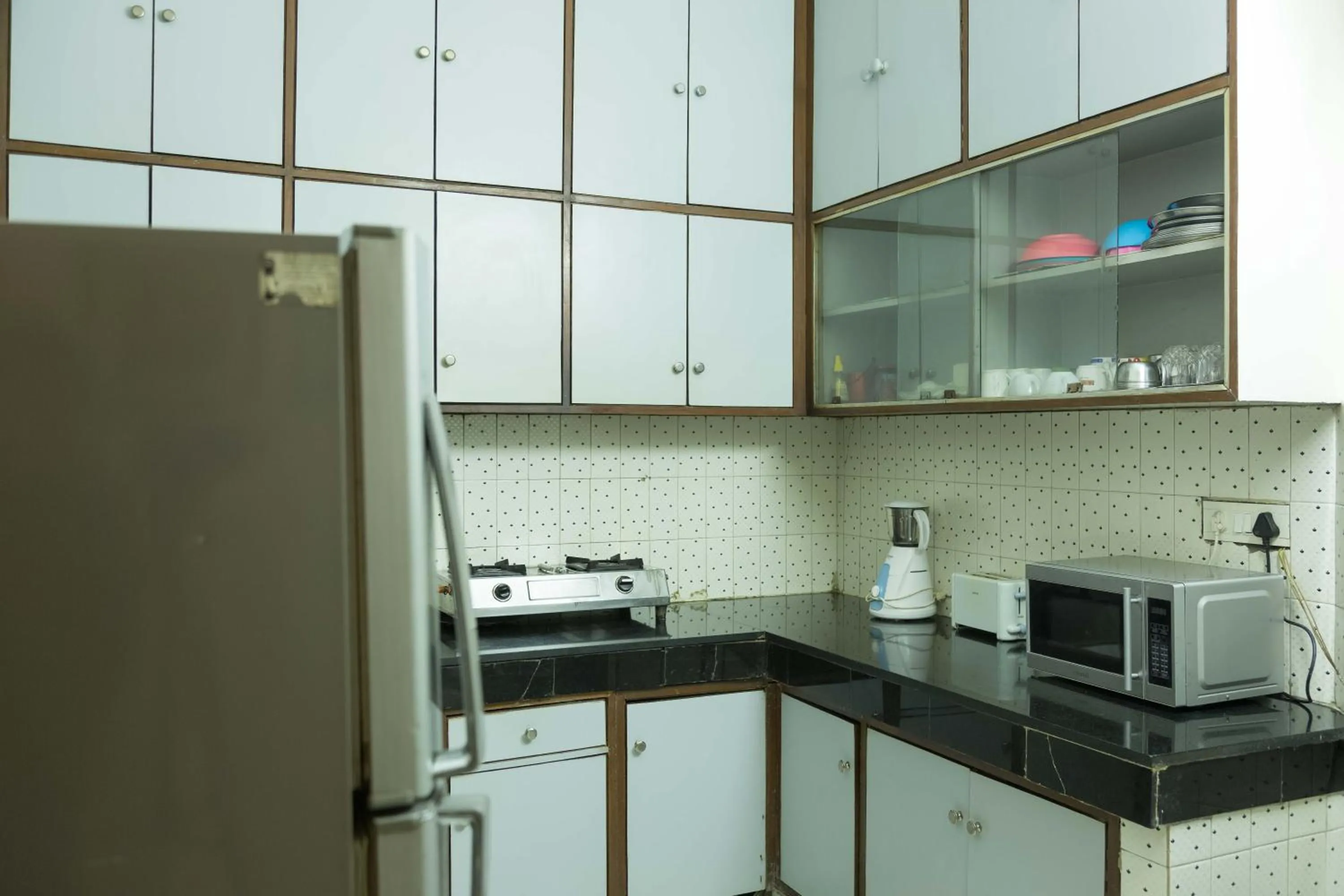 Kitchen or kitchenette in Woodpecker Apartments Hauz khas