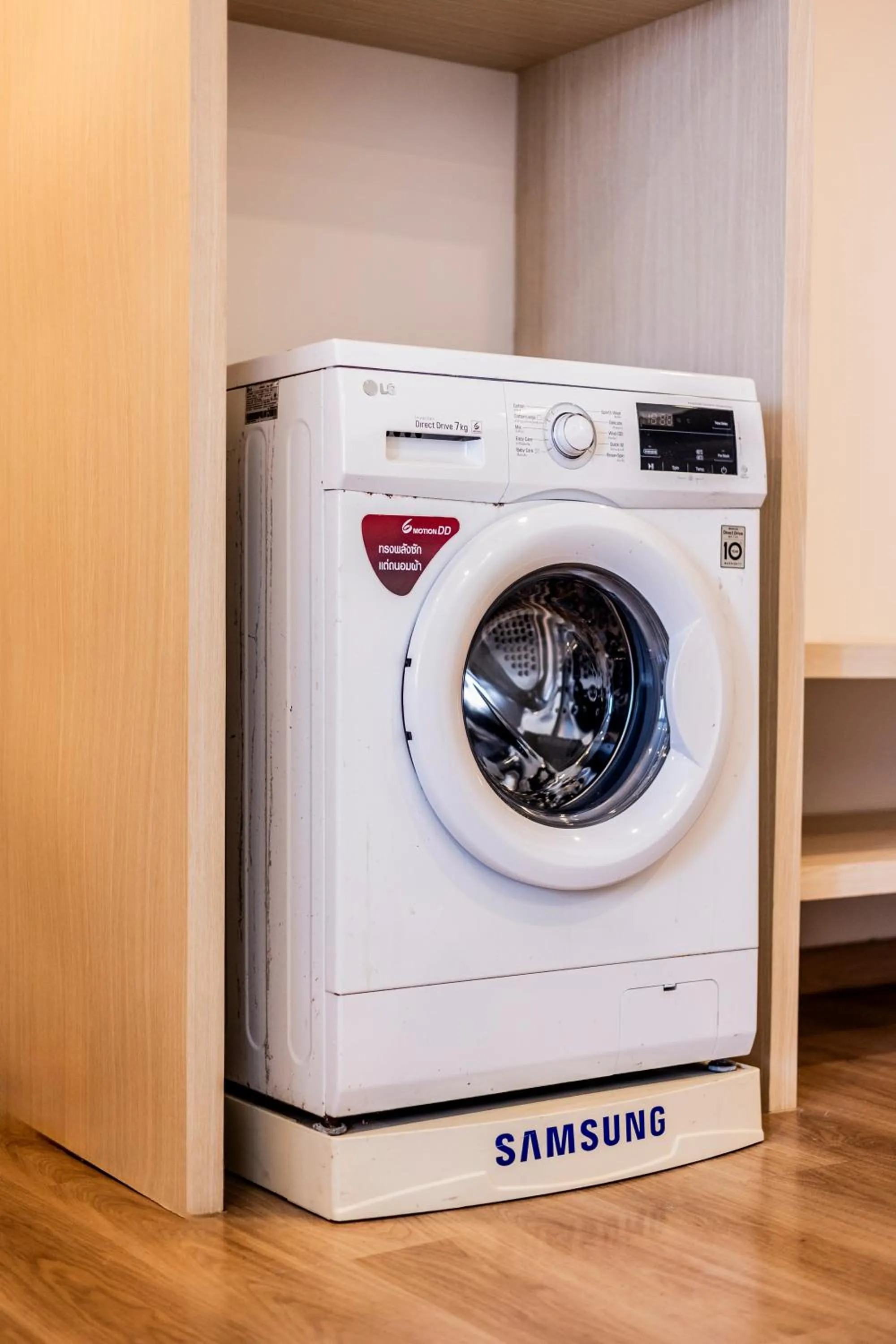 washing machine in Duplex Liora 1BR PoolsGym Shuttle to Nai Harn