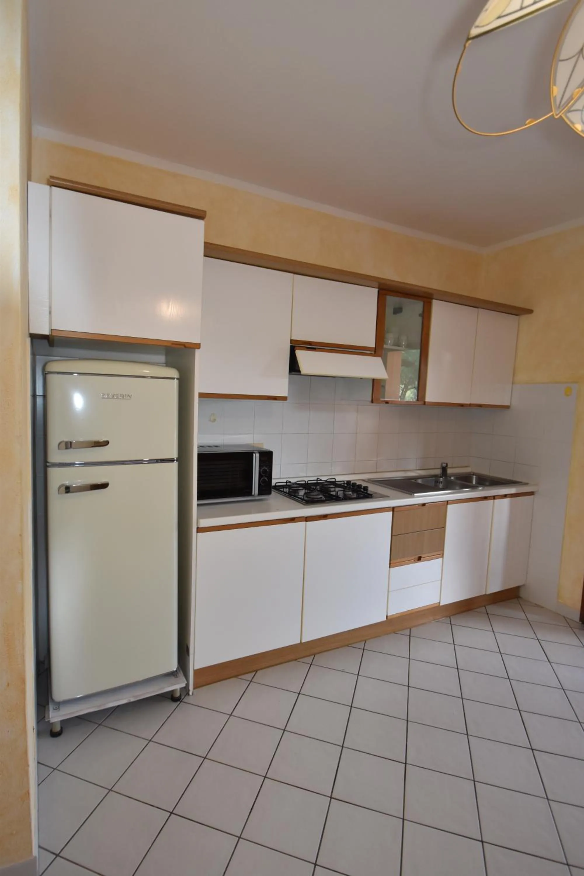 Kitchen or kitchenette in Casa Rosada - Piscina, aria condizionata, terrazze e posti auto