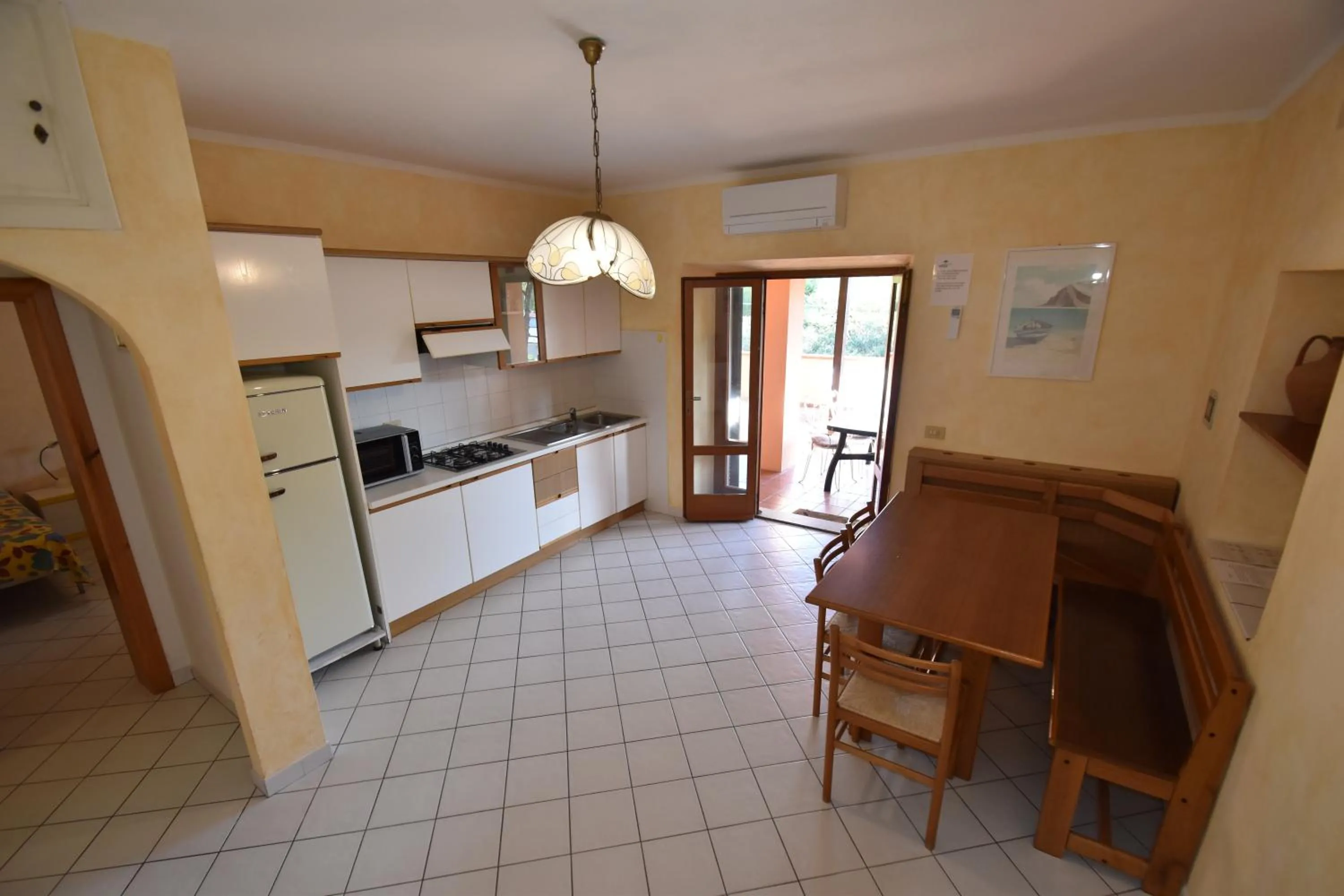 Kitchen or kitchenette in Casa Rosada - Piscina, aria condizionata, terrazze e posti auto