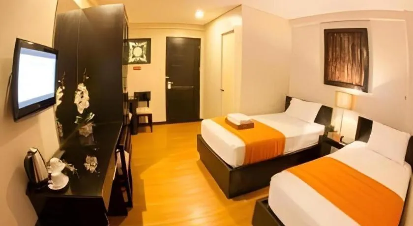 Bed in L Square Hotel