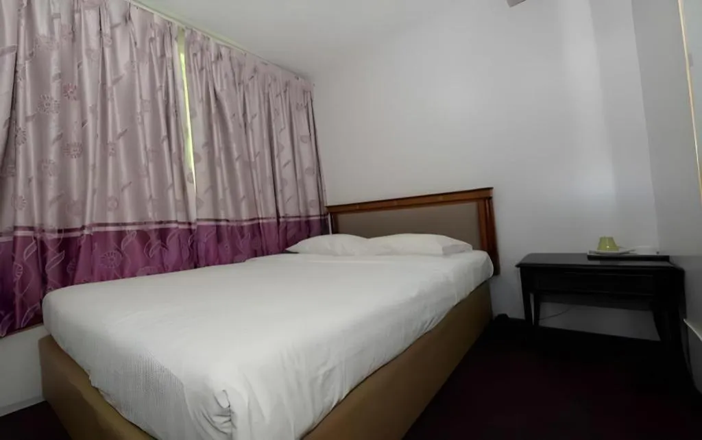 Bed in Meriton Hotel