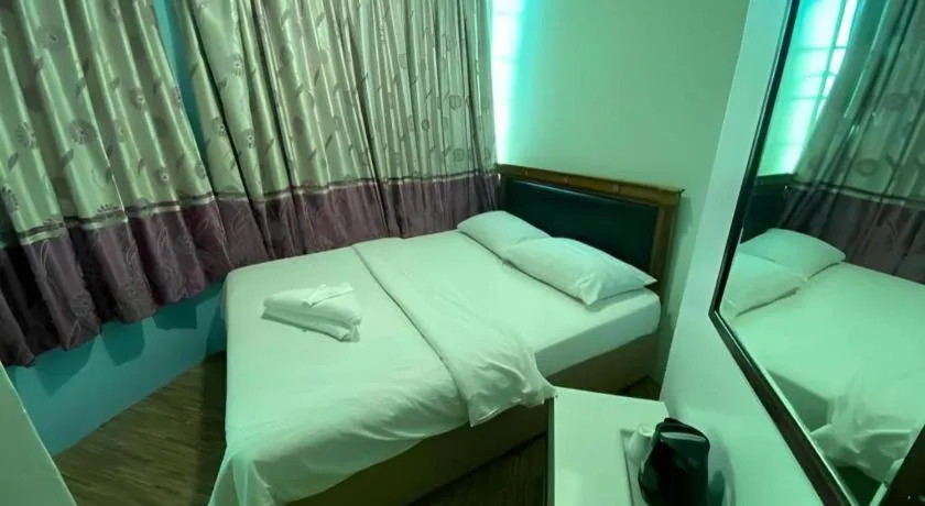 Bed in Meriton Hotel