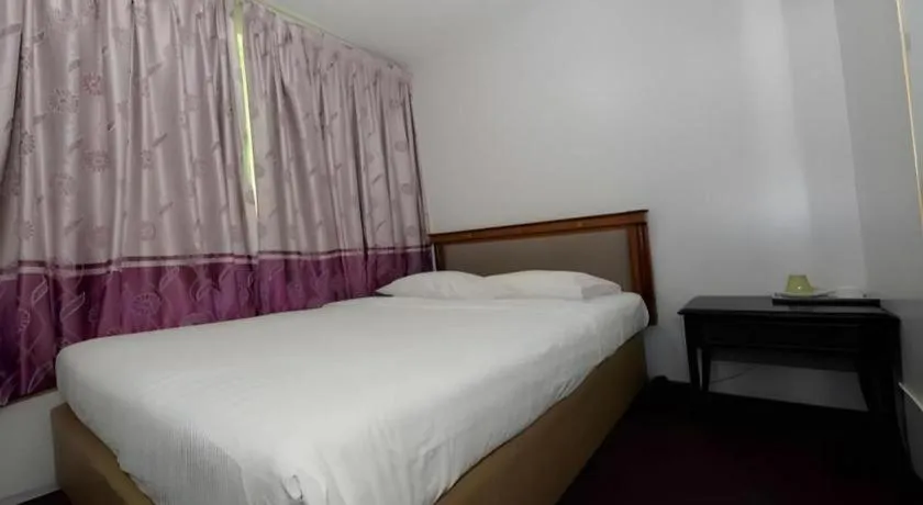 Bed in Meriton Hotel