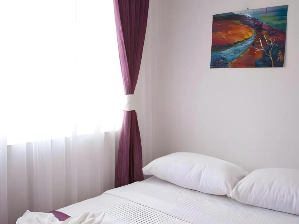 Bed in Meriton Hotel