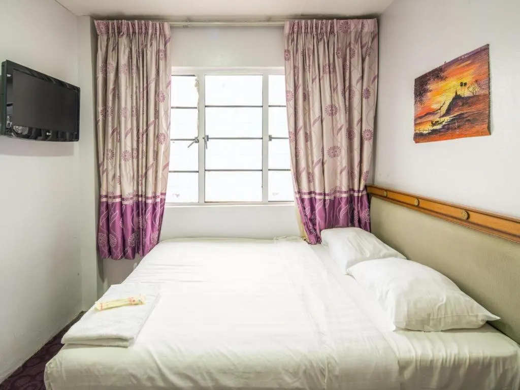 Bed in Meriton Hotel