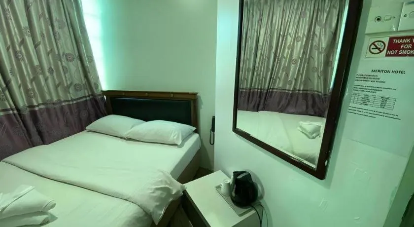 Bed in Meriton Hotel