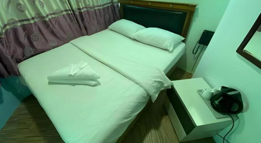 Bed in Meriton Hotel