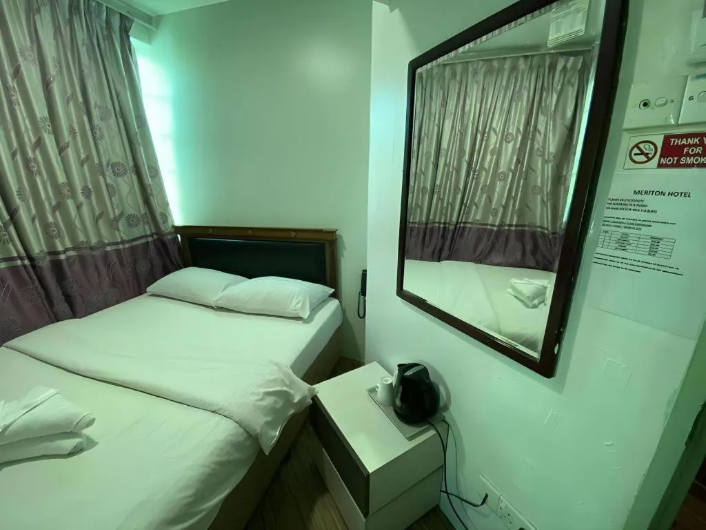 Bed in Meriton Hotel