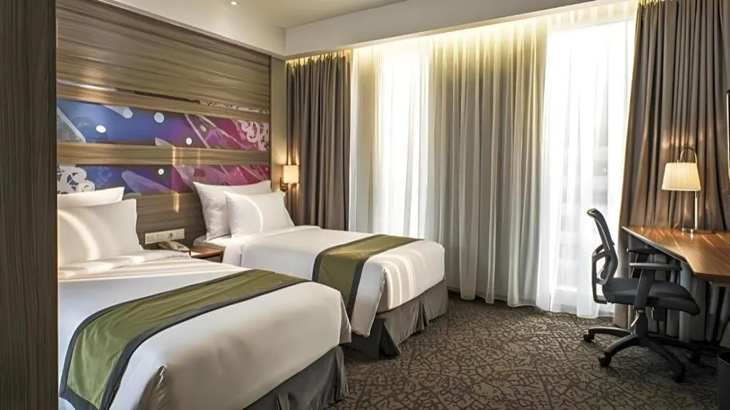 Bed in Hotel GranDhika Iskandarsyah