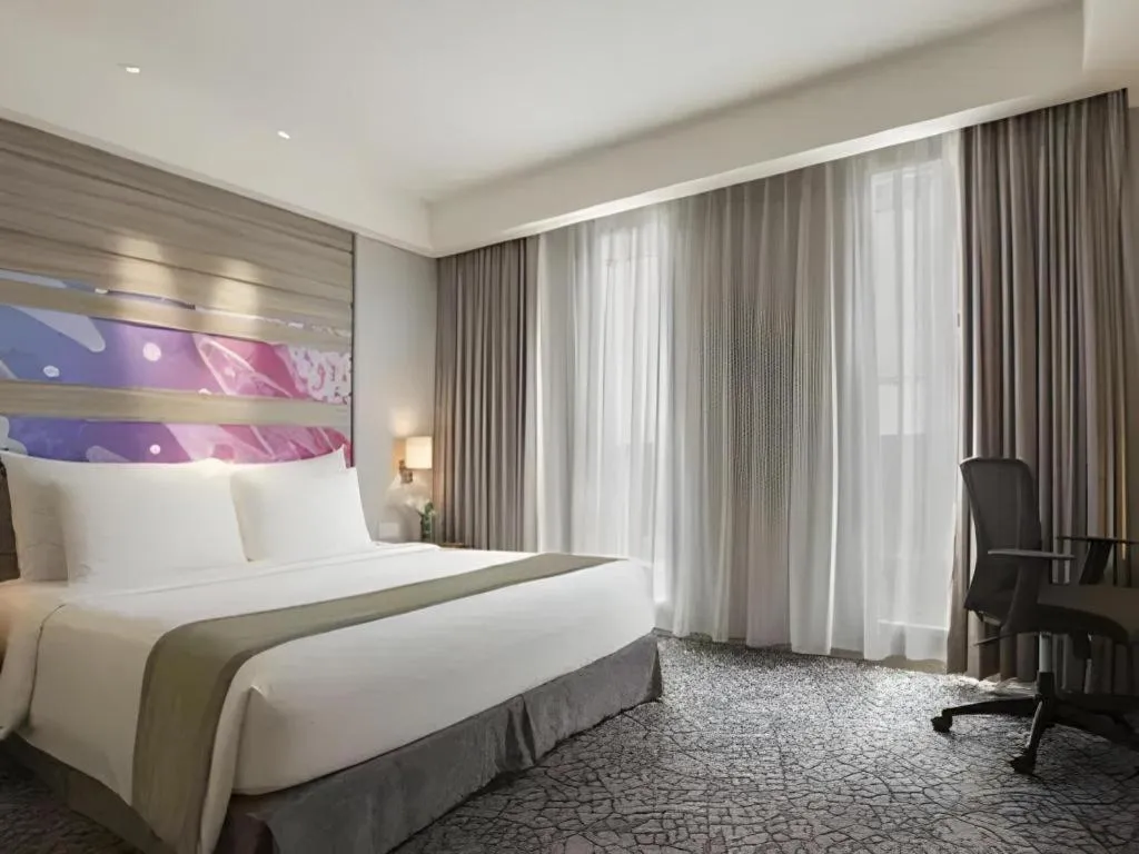 Bed in Hotel GranDhika Iskandarsyah