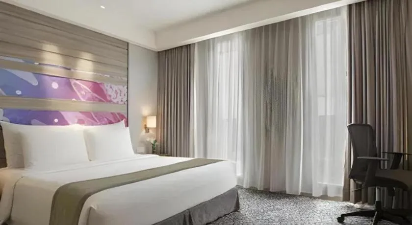 Bed in Hotel GranDhika Iskandarsyah