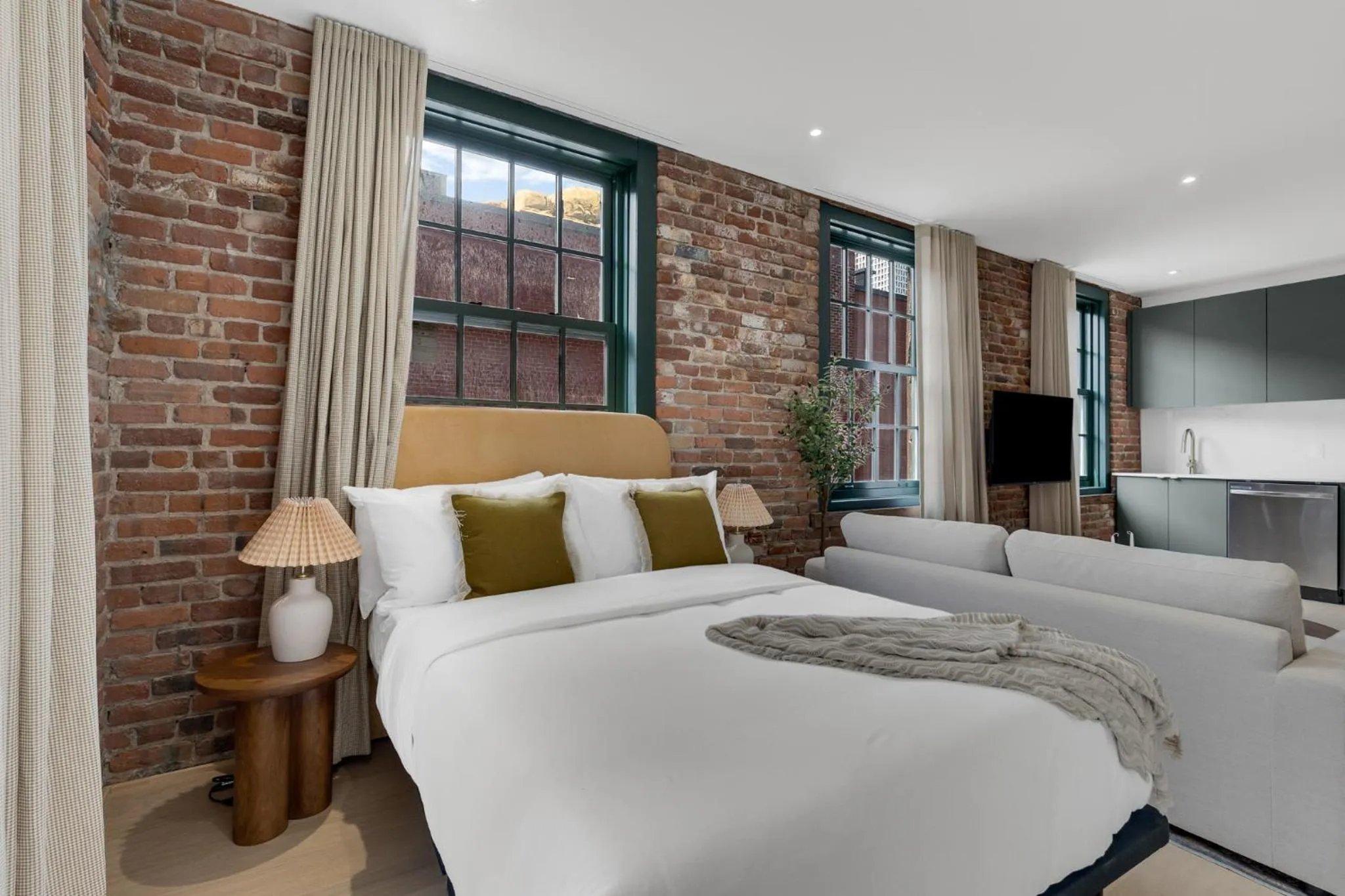 Bed in The Mercer Boutique Hotel