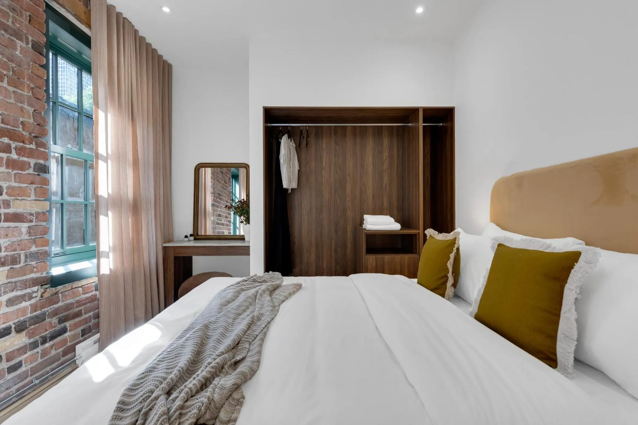 Bed in The Mercer Boutique Hotel